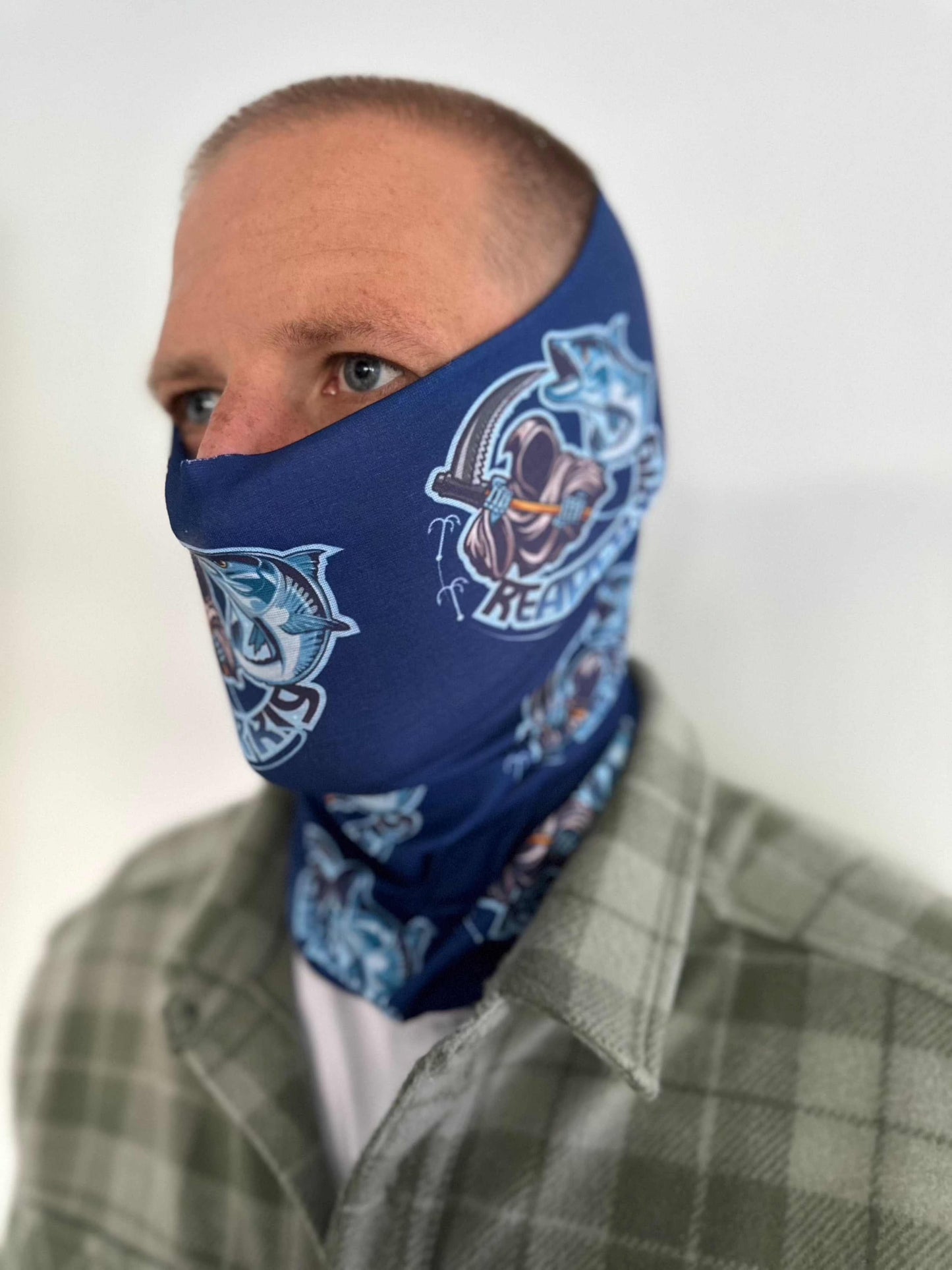 Blue Reaper Rig Neck Gaiter with logo design worn by person.